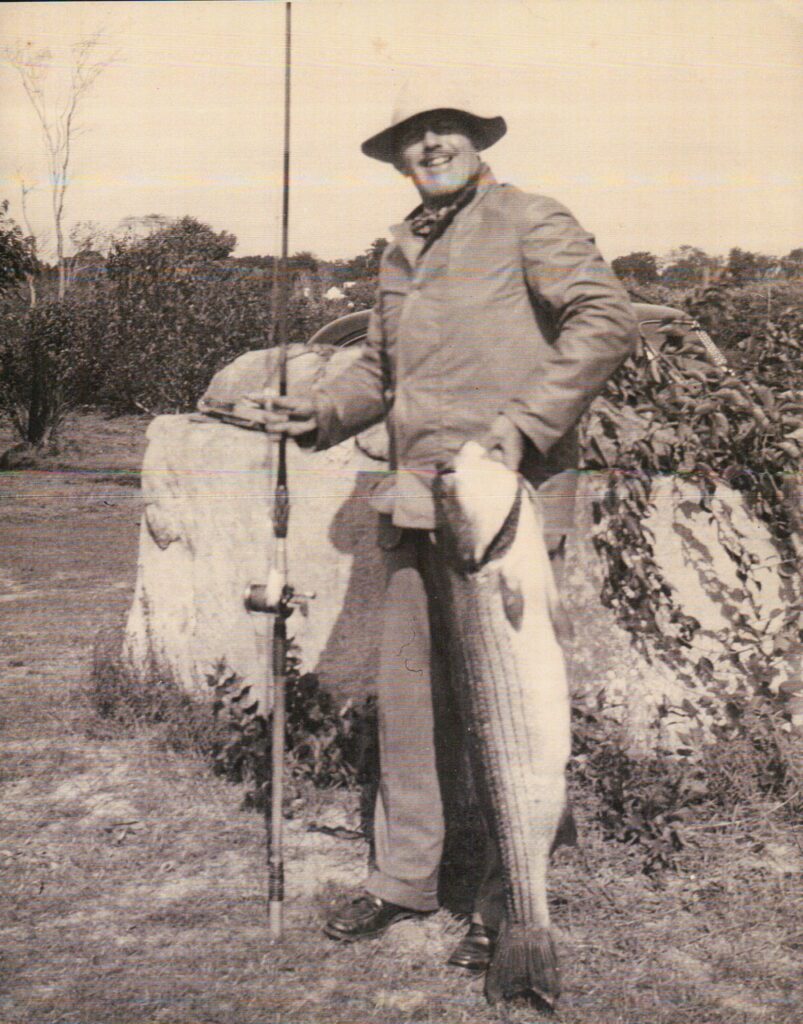 Nelson C. White with striped bass
